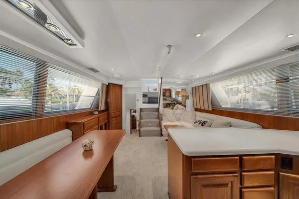 Slide: The Image of Luxurious interior of a 1993 Viking Convertible yacht with elegant wood finishes. - 25