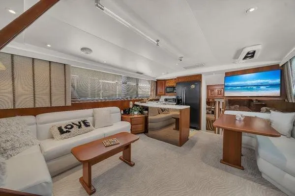 Slide: The Image of Luxurious interior of a 1993 Viking Convertible yacht with modern furnishings and cozy seating. - 26