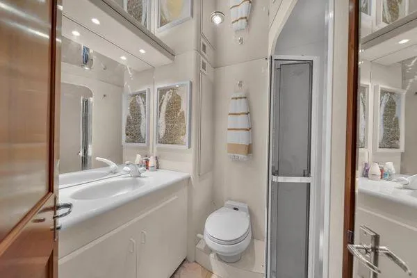 Slide: The Image of Bathroom interior of a 1993 Viking Convertible yacht with modern fixtures. - 33