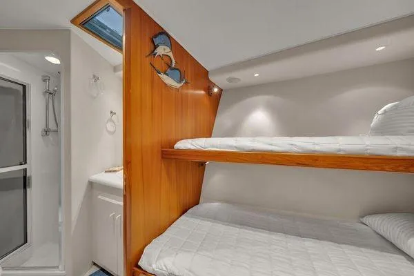 Slide: The Image of 1993 Viking Convertible yacht interior with bunk beds and bathroom. - 40