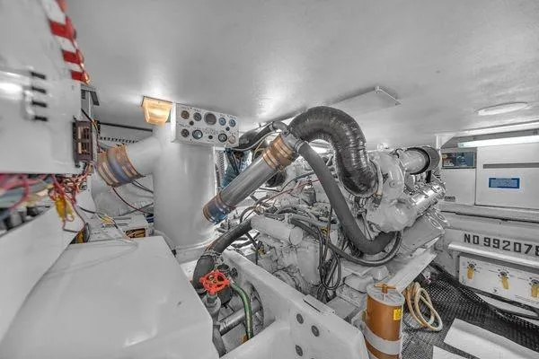 Slide: The Image of Engine room of a 1993 Viking Convertible yacht, showcasing machinery and components. - 55