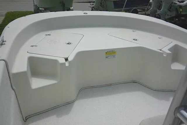 Slide: The Image of 2013 Carolina Skiff 198 DLV boat interior with storage compartments. - 14