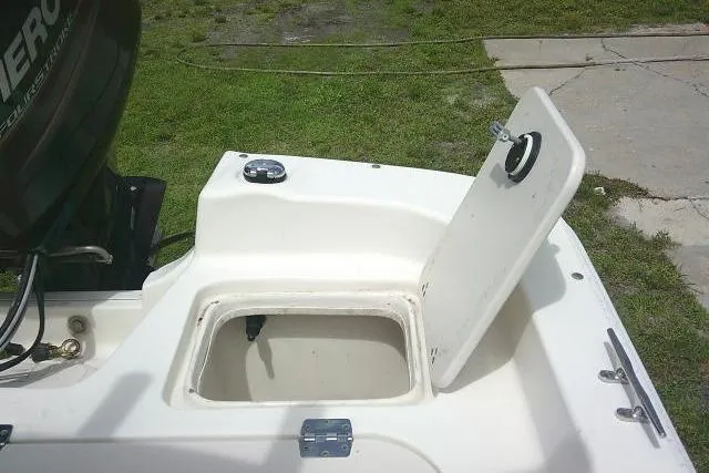 Slide: The Image of Open storage compartment on a 2013 Carolina Skiff 198 DLV boat. - 18