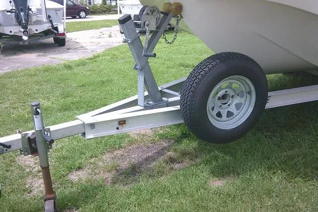 Slide: The Image of Trailer for 2013 Carolina Skiff 198 DLV boat on grassy area. - 6
