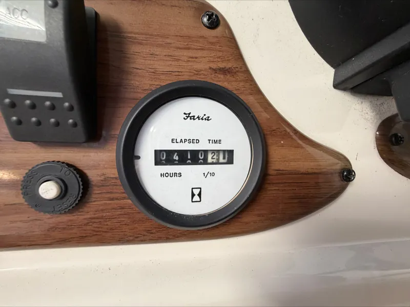 Slide: The Image of Close-up of an hour meter on a boat, displaying 412 hours. - 14