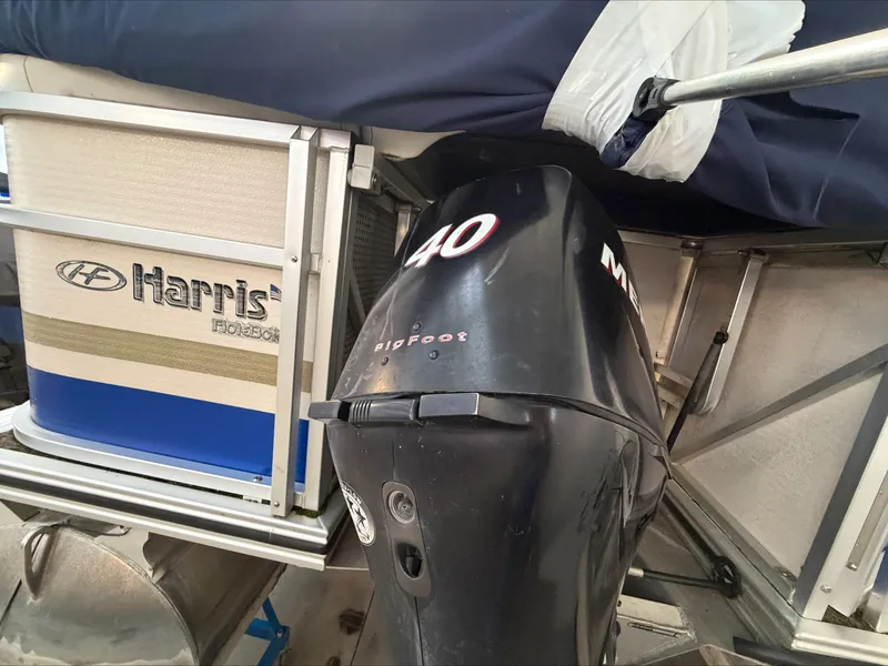 Slide: The Image of A 2007 Harris Sunliner 180 with a 40 HP Mercury outboard motor. - 25