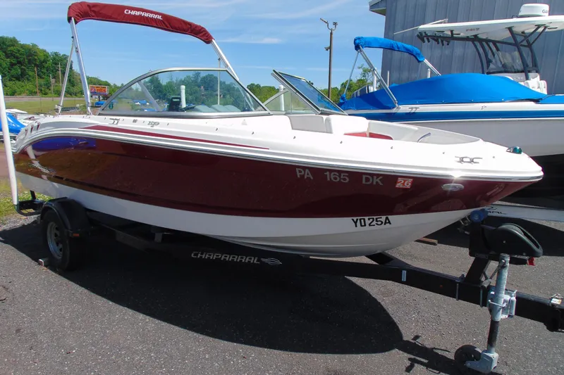 The Image of 2013 Chaparral 19 Sport H2O boat on trailer, red and white exterior. - 1