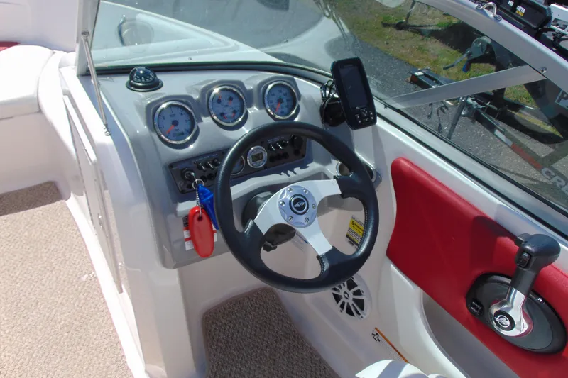 Slide: The Image of Steering console of 2013 Chaparral 19 Sport H2O boat with gauges and controls. - 10