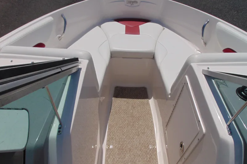 Slide: The Image of 2013 Chaparral 19 Sport H2O boat interior with white and red seating. - 12