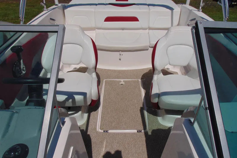 Slide: The Image of Interior of 2013 Chaparral 19 Sport H2O boat with white and red seating. - 13