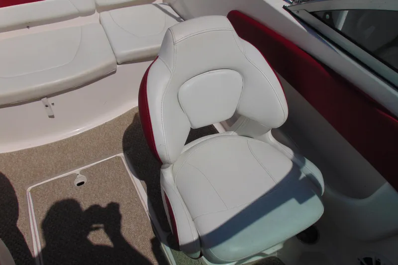 Slide: The Image of White and red seating in 2013 Chaparral 19 Sport H2O boat interior. - 15