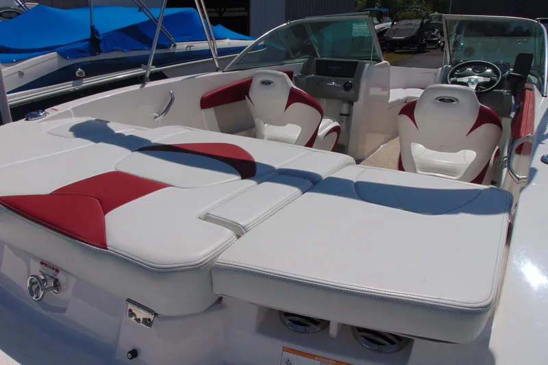 Slide: The Image of 2013 Chaparral 19 Sport H2O boat interior with white and red seating. - 5