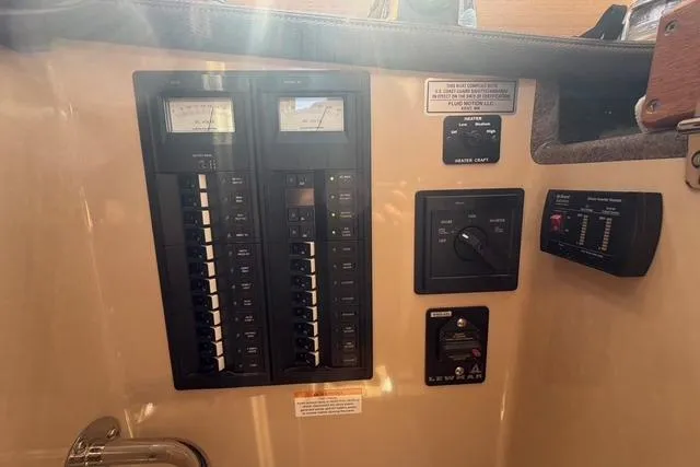 Slide: The Image of Electrical panel of a 2016 Ranger Tugs R-27 boat interior. - 28