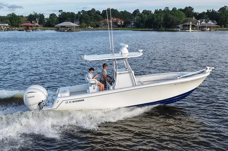 The Image of 2022 Contender 28 Tournament boat cruising on a scenic lake. - 0