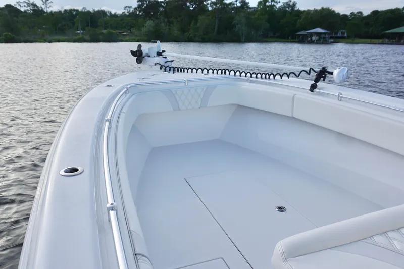 Slide: The Image of 2022 Contender 28 Tournament boat on calm water, showcasing spacious deck and sleek design. - 12