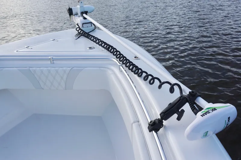 Slide: The Image of 2022 Contender 28 Tournament boat bow with trolling motor on water. - 14