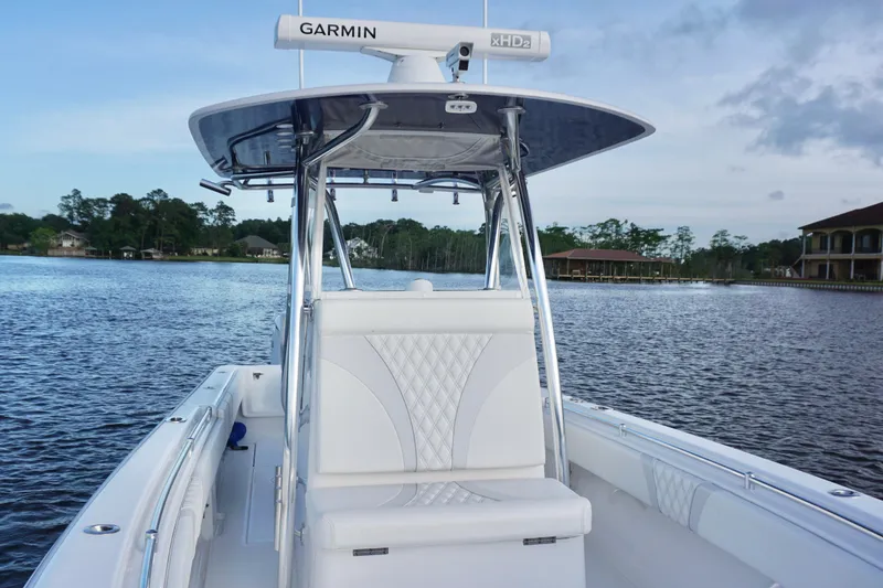 Slide: The Image of 2022 Contender 28 Tournament boat on calm water, featuring Garmin radar and sleek design. - 15