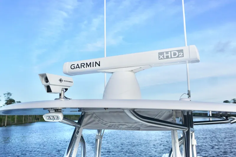 Slide: The Image of 2022 Contender 28 Tournament boat with Garmin xHD2 radar on calm water. - 18