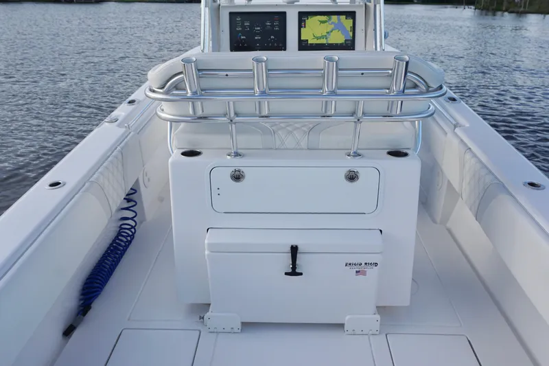 Slide: The Image of 2022 Contender 28 Tournament boat interior with rod holders and navigation screens. - 28