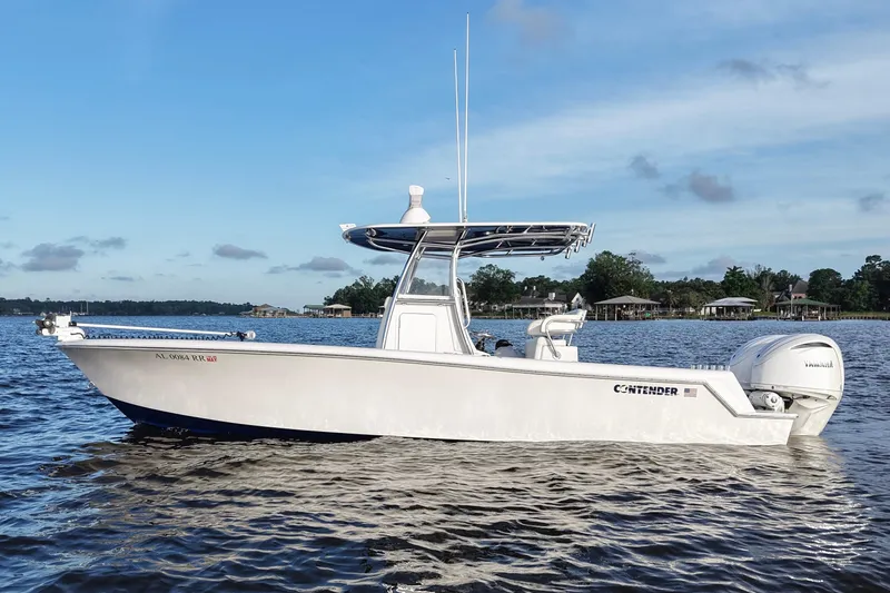Slide: The Image of 2022 Contender 28 Tournament boat on calm water, clear sky background. - 3