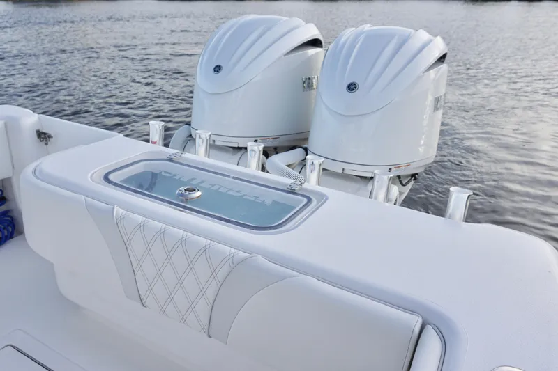 Slide: The Image of 2022 Contender 28 Tournament boat with dual outboard engines on water. - 31