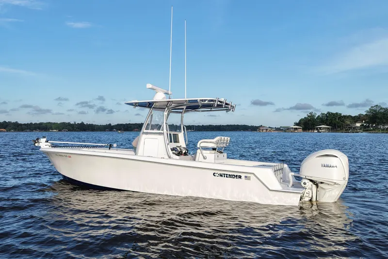 Slide: The Image of 2022 Contender 28 Tournament boat on calm water, featuring Yamaha outboard engine. - 4