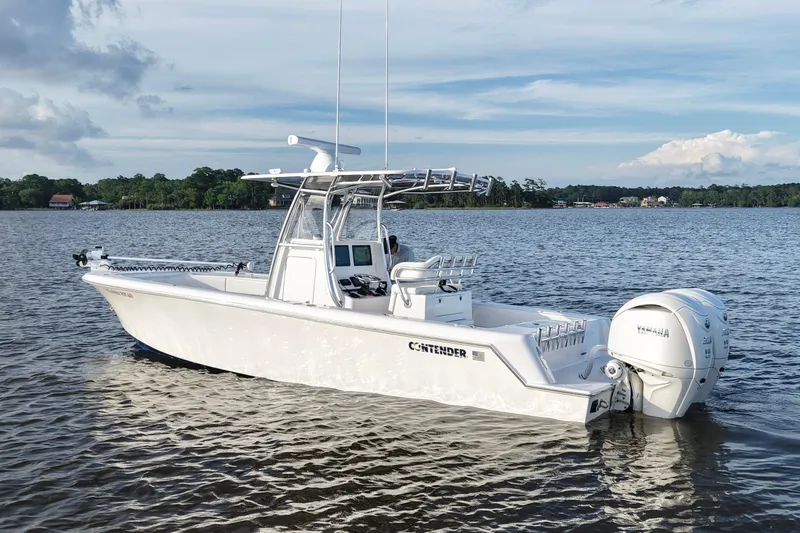 Slide: The Image of 2022 Contender 28 Tournament boat on calm water with Yamaha engines. - 5