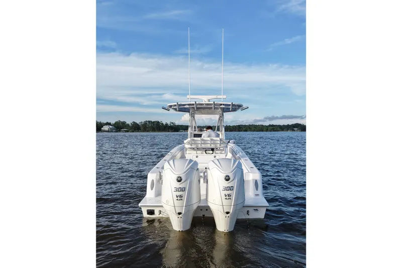 Slide: The Image of 2022 Contender 28 Tournament boat with dual 300 V6 engines on open water. - 7