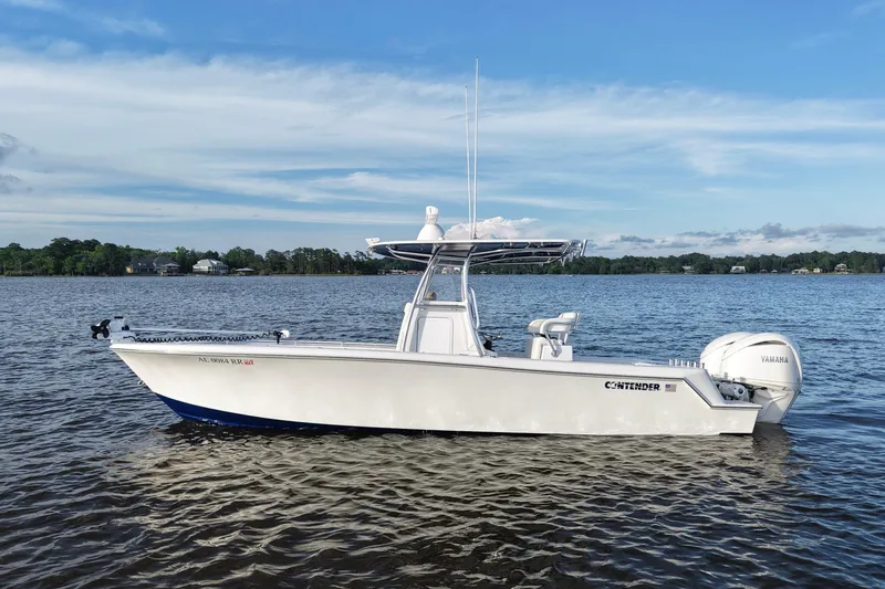 Slide: The Image of 2022 Contender 28 Tournament boat on calm water with Yamaha engine. - 8