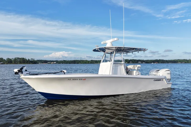 Slide: The Image of 2022 Contender 28 Tournament boat on calm water under blue sky. - 9
