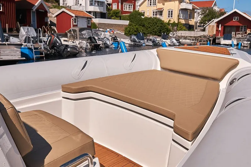 Slide: The Image of Luxurious seating on 2026 Northstar Orion 7 boat, docked in a scenic marina. - 12