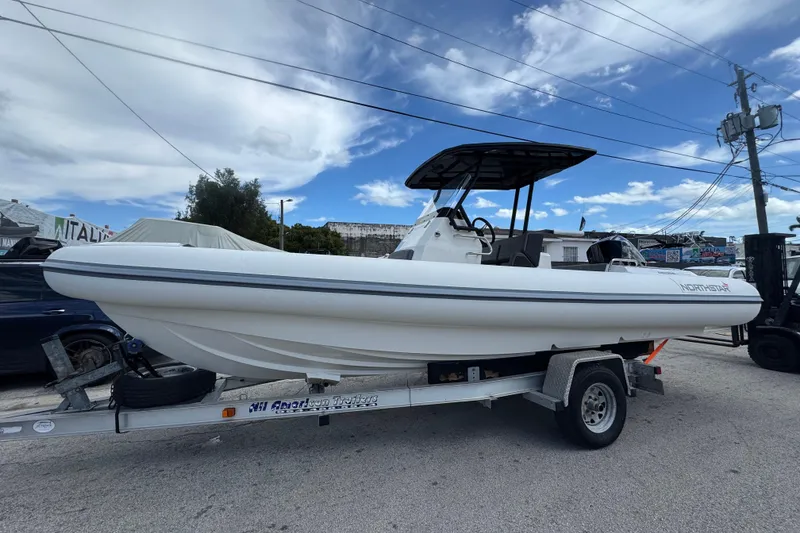 Slide: The Image of 2026 Northstar Orion 7 boat on trailer under blue sky. - 4