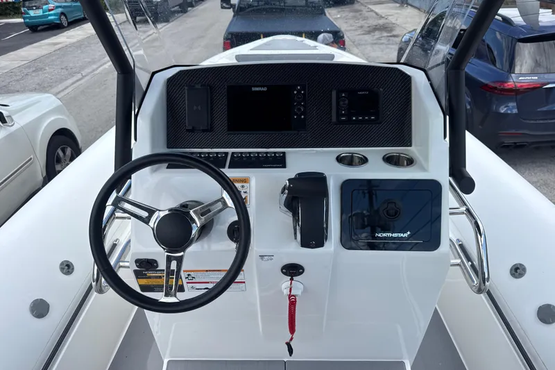 Slide: The Image of 2026 Northstar Orion 7 boat dashboard with steering wheel and control panel. - 5