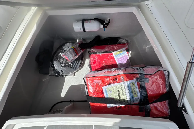 Slide: The Image of Storage compartment of 2026 Northstar Orion 7 with life jackets and safety equipment. - 8