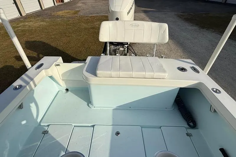 Slide: The Image of 2023 Pair Customs 24 Center Console DV boat interior with seating and storage compartments. - 10