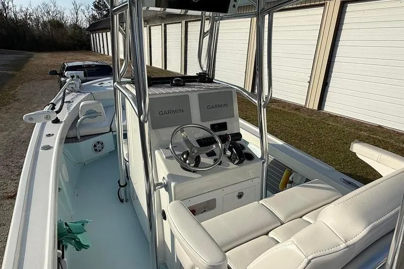 Slide: The Image of 2023 Pair Customs 24 Center Console DV boat with Garmin navigation system. - 16