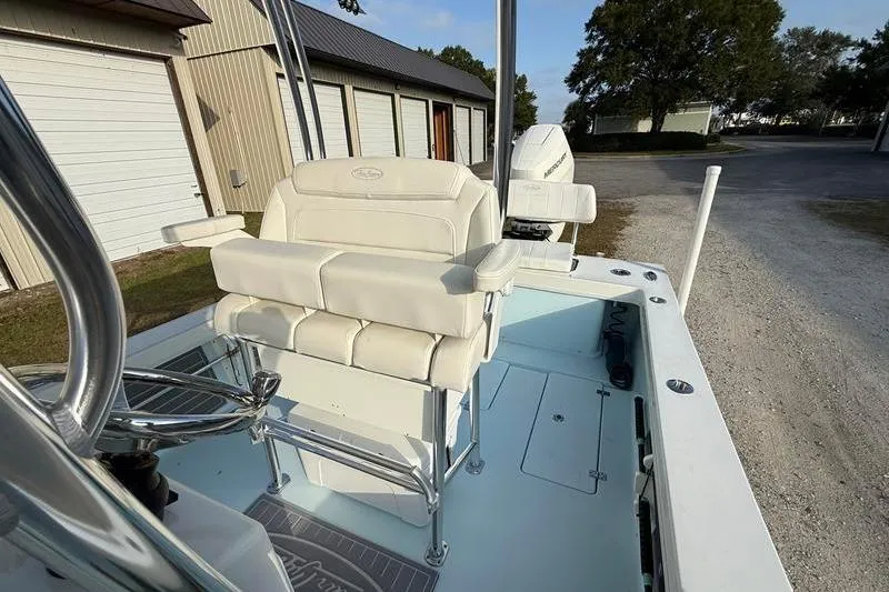 Slide: The Image of 2023 Pair Customs 24 Center Console DV boat with white seating and modern design. - 17