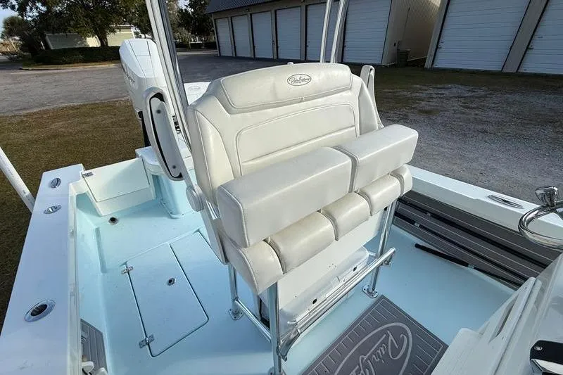 Slide: The Image of 2023 Pair Customs 24 Center Console DV boat with white seating and sleek design. - 18