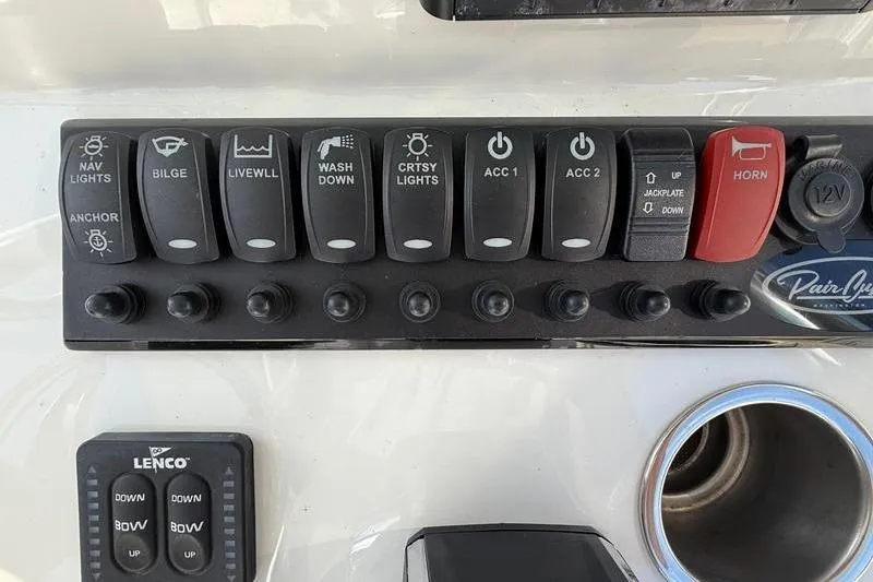 Slide: The Image of Control panel of 2023 Pair Customs 24 Center Console DV boat with various switches. - 20