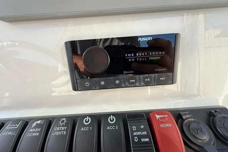 Slide: The Image of Control panel of 2023 Pair Customs 24 Center Console DV with Fusion audio system. - 21
