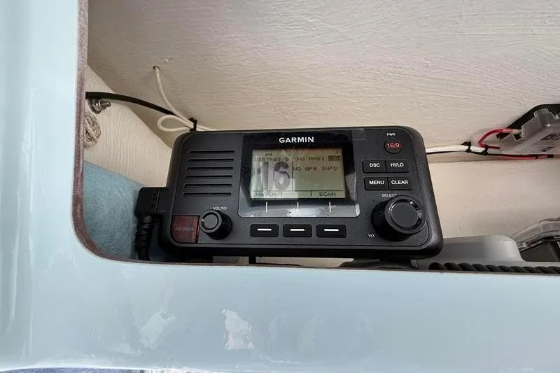 Slide: The Image of Garmin marine radio installed on 2023 Pair Customs 24 Center Console DV boat. - 23