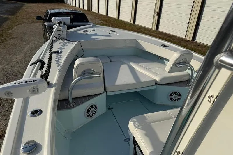 Slide: The Image of 2023 Pair Customs 24 Center Console DV boat with spacious seating and modern design. - 24