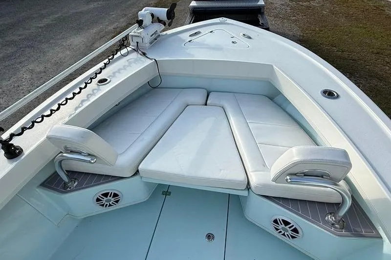 Slide: The Image of 2023 Pair Customs 24 Center Console DV boat with white cushioned seating and modern design. - 27