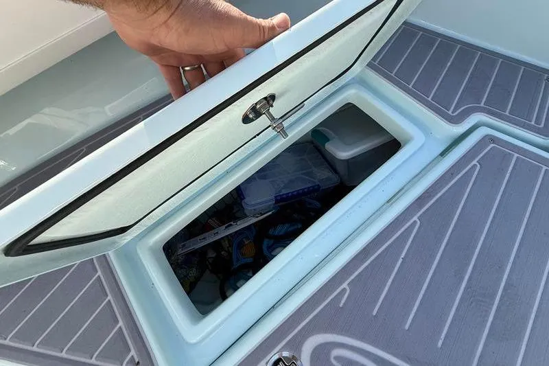 Slide: The Image of Storage compartment on 2023 Pair Customs 24 Center Console DV boat. - 31