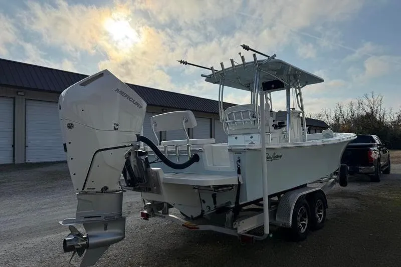 Slide: The Image of 2023 Pair Customs 24 Center Console DV boat on trailer, parked outdoors. - 4