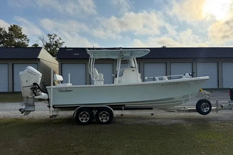 Slide: The Image of 2023 Pair Customs 24 Center Console DV boat on trailer, parked outdoors. - 5