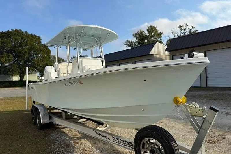 Slide: The Image of 2023 Pair Customs 24 Center Console DV boat on trailer, parked outdoors. - 6