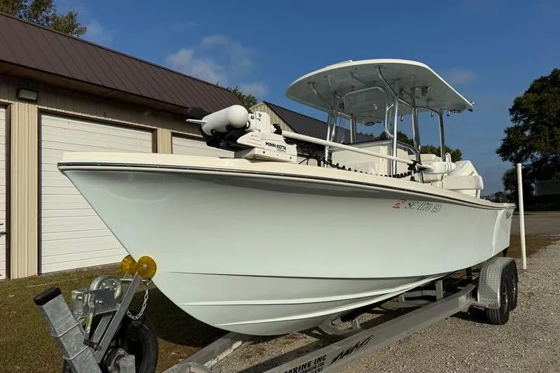 Slide: The Image of 2023 Pair Customs 24 Center Console DV boat on trailer, parked outdoors. - 7