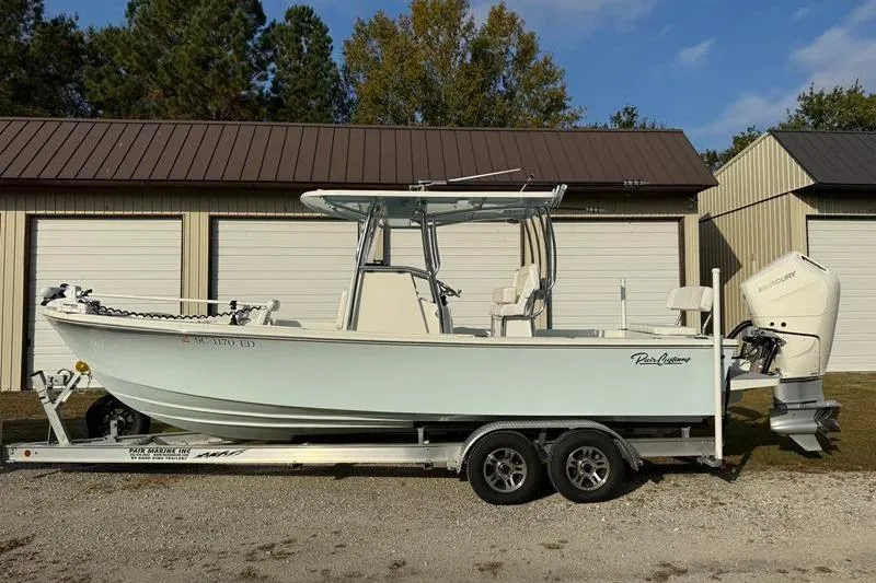 Slide: The Image of 2023 Pair Customs 24 Center Console DV boat on trailer, parked outdoors. - 8