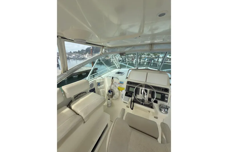 Slide: The Image of Interior view of 2005 Rampage 33 Express boat cockpit with steering wheel and controls. - 5